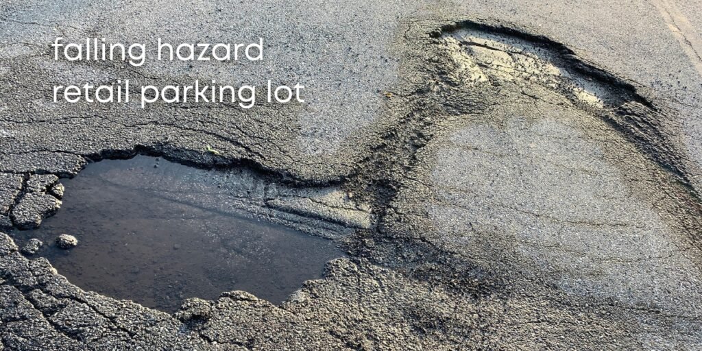 falling in a pothole on a commercial parking lot is negligence.